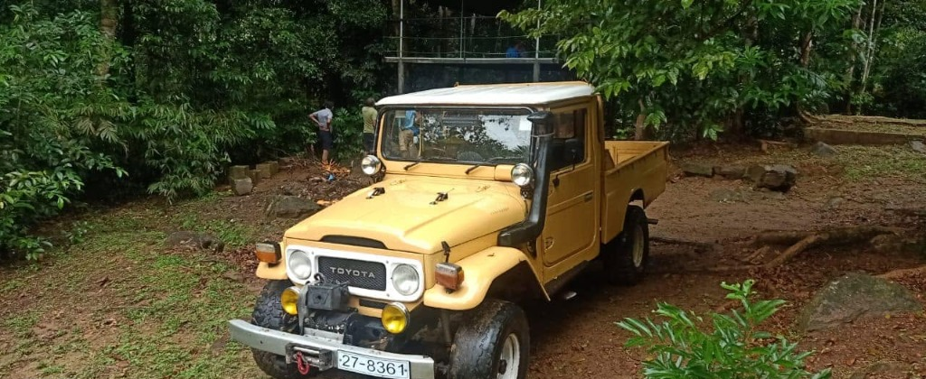 Adventure vehicle driving through rugged muddy paths